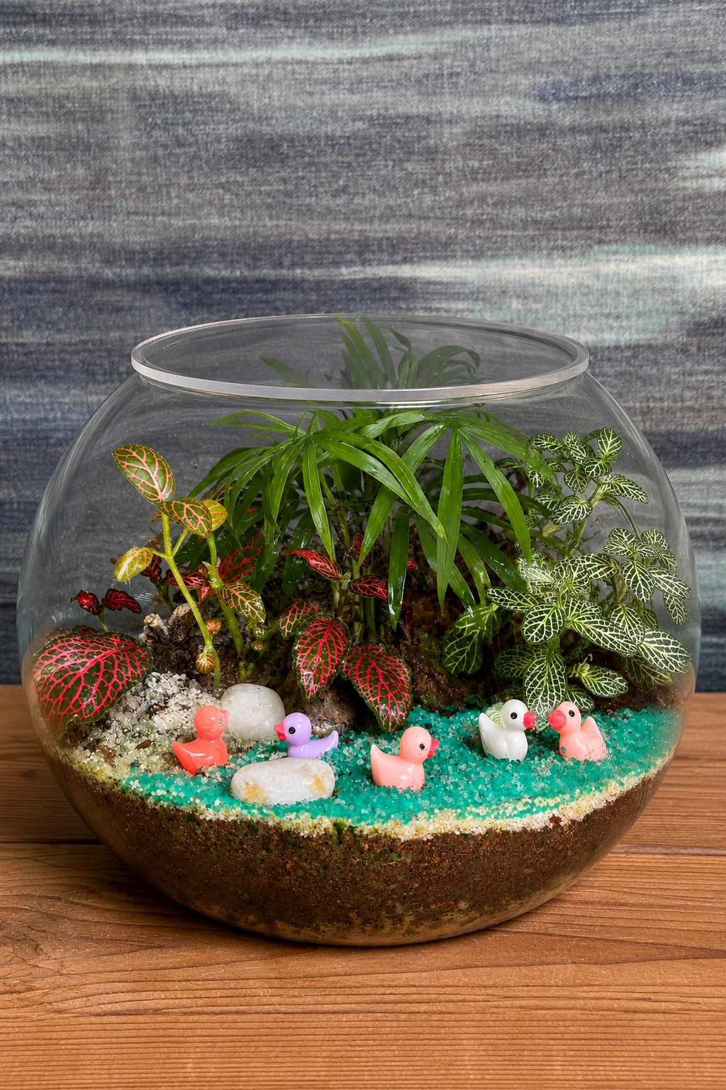 Duckling Pond Terrarium from Planterie, a handcrafted Fish Bowl glass terrarium featuring adorable baby duck miniatures and live plants in a cozy indoor desktop micro-garden, perfect as terrarium in Delhi for plant gifts in Delhi, desktop indoor plants and plant gifting near me Delhi
