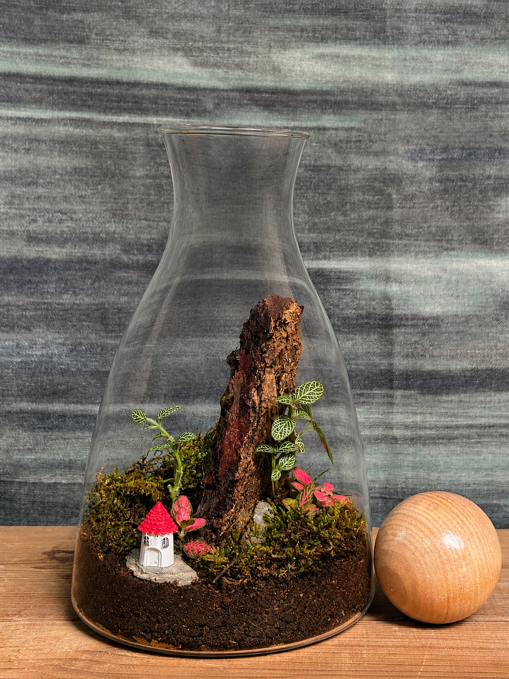 Forest Cottage Terrarium featuring a tiny weather system with cottage miniature from Planterie, a tropical micro-climate that needs surprisingly little water, perfect for low maintenance indoor plants for beginners, indoor plants for low light in Indian homes and best plants for AC rooms in India, with care tips for open jar spray lightly when soil looks dry