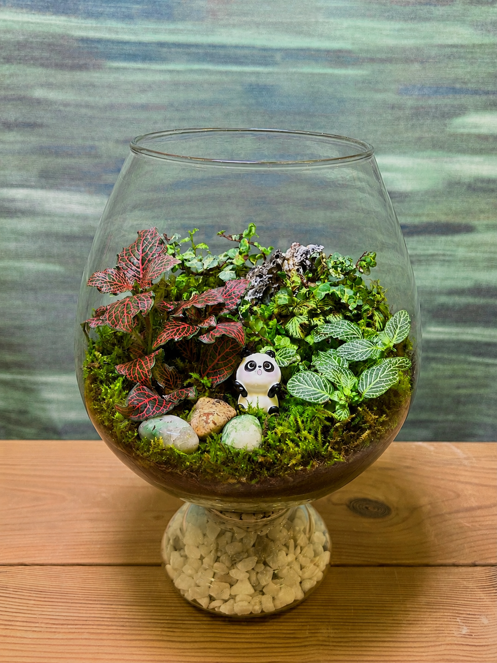 Panda Moss Terrarium from Planterie, a charming desktop terrarium featuring lush panda moss carefully arranged to create a miniature landscape that brings the serenity of nature indoors, perfect for your workspace as plant gifts in Delhi for housewarmings and centre table plant arrangement in Delhi