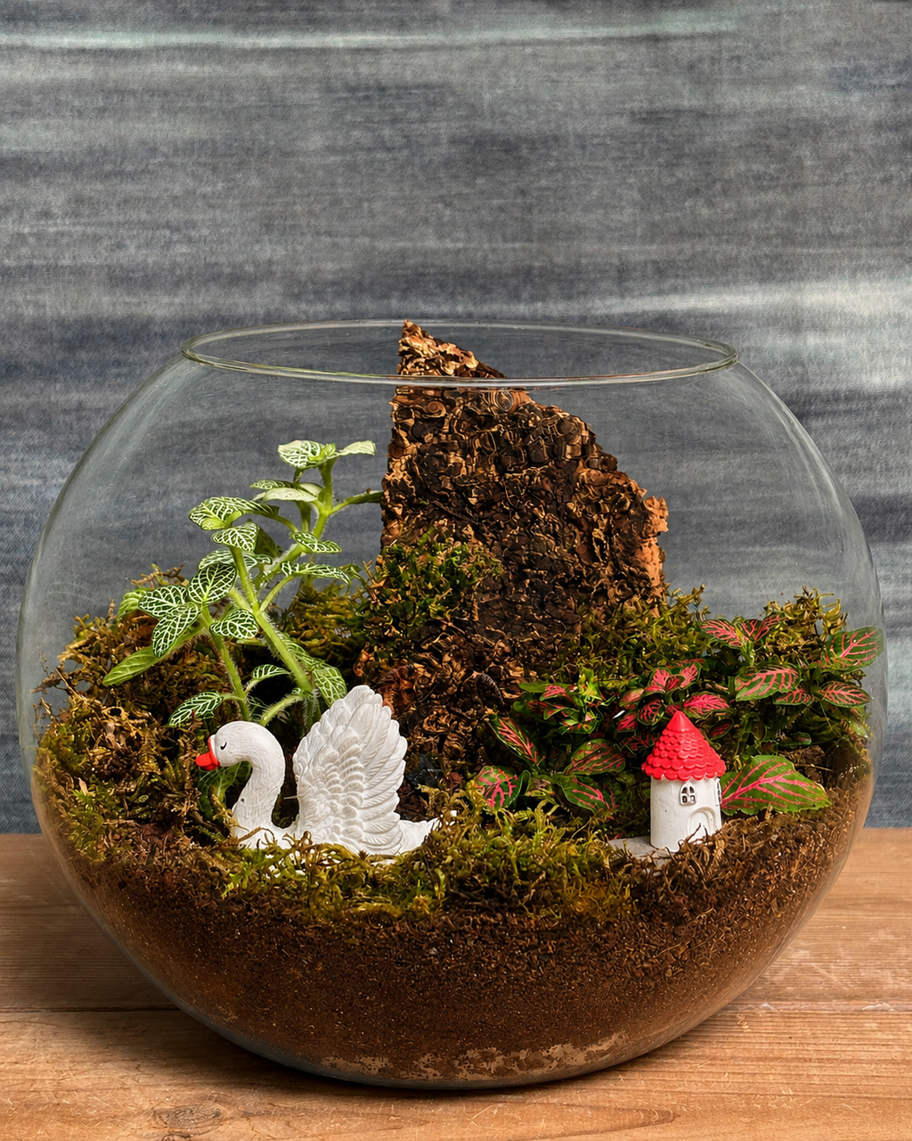 Swan & House Terrarium featuring a tiny weather system with swan and house miniatures from Planterie, a tropical micro-climate that needs surprisingly little water, perfect for low maintenance indoor plants for beginners, indoor plants for low light in Indian homes and best plants for AC rooms in India, with care tips for open jar spray lightly when soil looks dry
